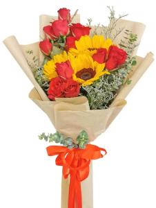 Pure Mixed Floral Bliss with yellow sunflowers, red roses, Misty Blue, eucalyptus, rosal leaves, kraft wrap, and orange ribbon for delivery in Intramuros Manila