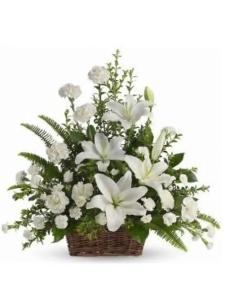 Elegant white Stargazer and Carnation sympathy flower basket for funeral delivery in Guiguinto Bulacan